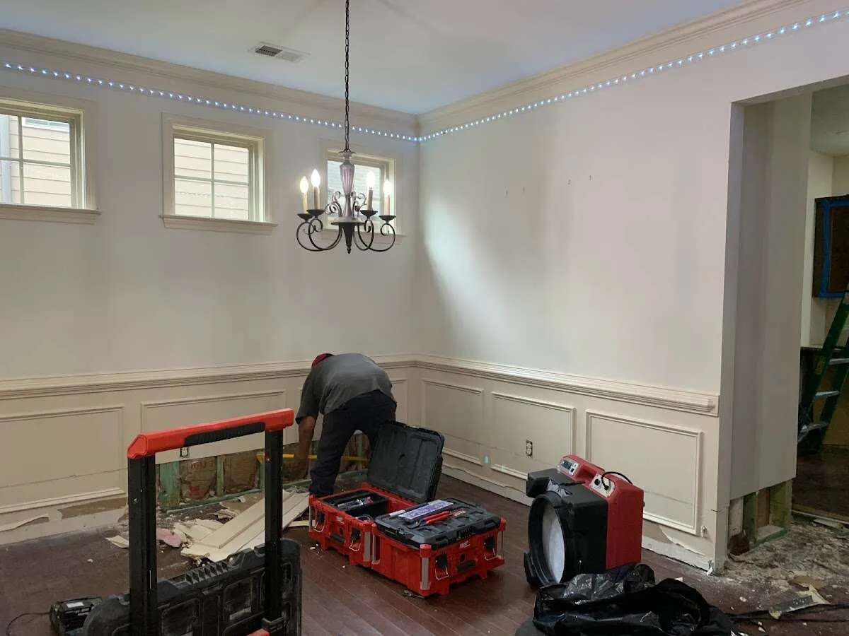 Restoration technician with professional equipment in Alexandria